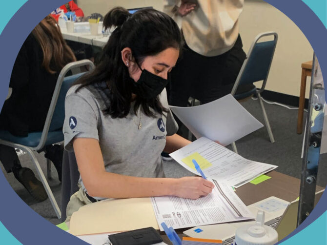 Volunteer assists in tax preparation.